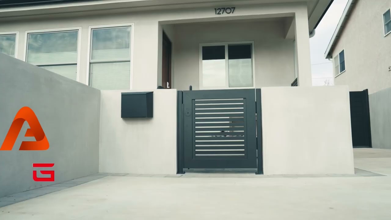 Real aluminum double-swing gate project showing the two-leaf frame system