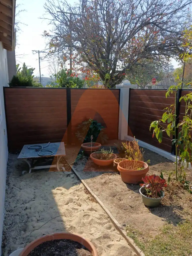 ALU 60 T&G wood grain fence installed by Aluglobus Aluminum Systems