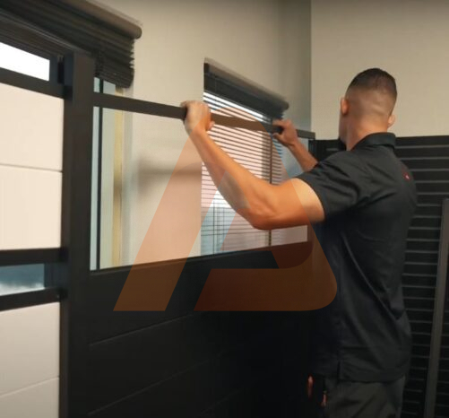 Expert adjusting the top rail to create a privacy gap