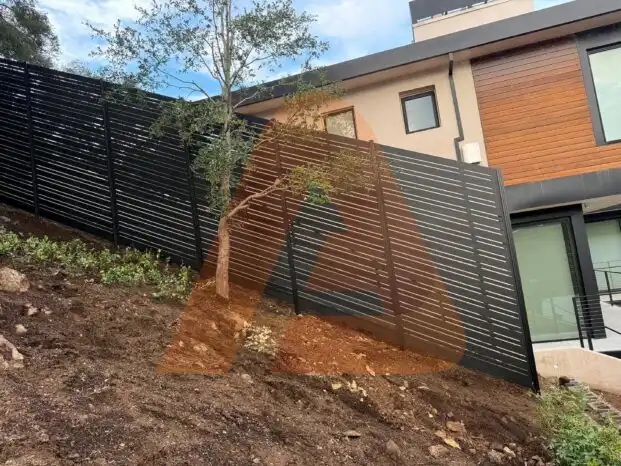 ALU 20 black slat fence installed by Aluglobus Aluminum Systems
