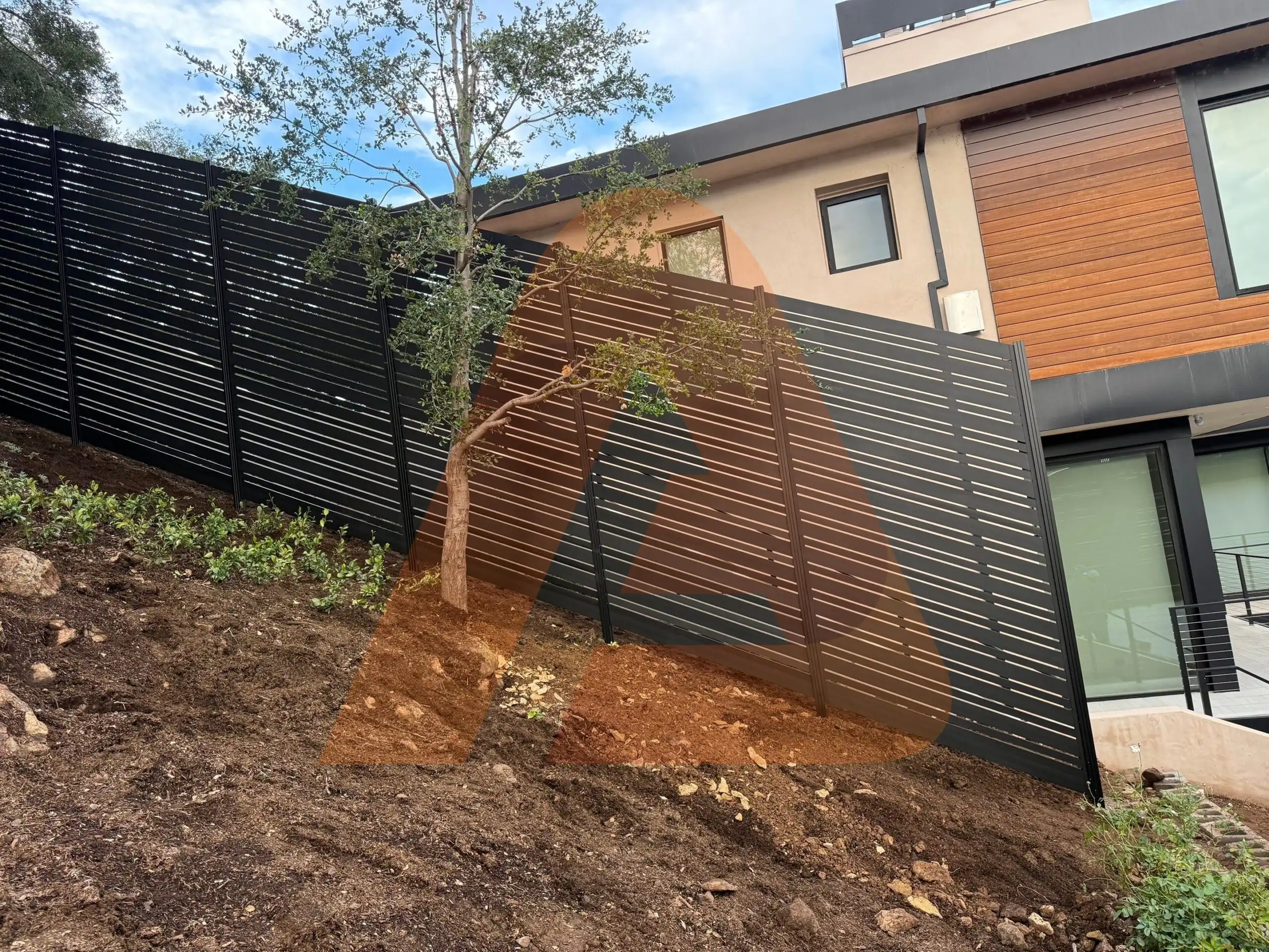 ALU 20 black slat fence installed by Aluglobus Aluminum Systems