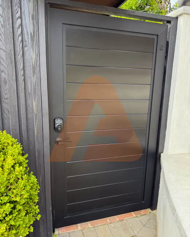 ALU 60 T&G black pedestrian gate installed by Aluglobus Aluminum Systems