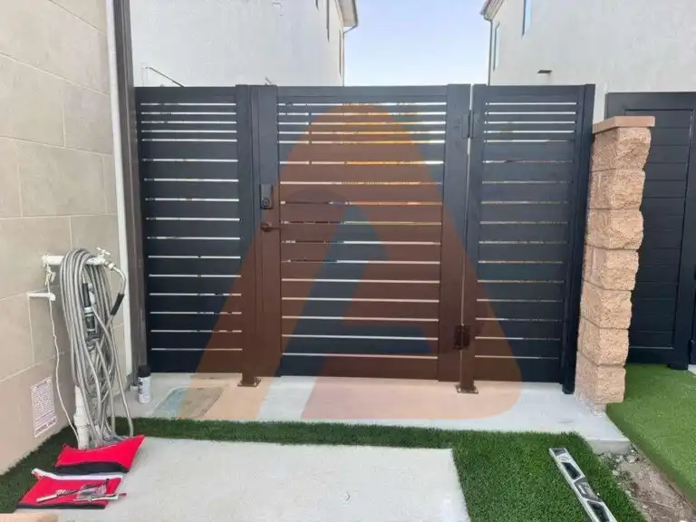 ALU 20 black slat driveway gate installed by Aluglobus Aluminum Systems