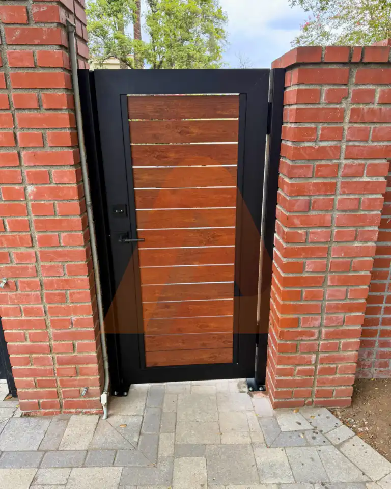 ALU 40 wood grain slat pedestrian gate installed by Aluglobus Aluminum Systems
