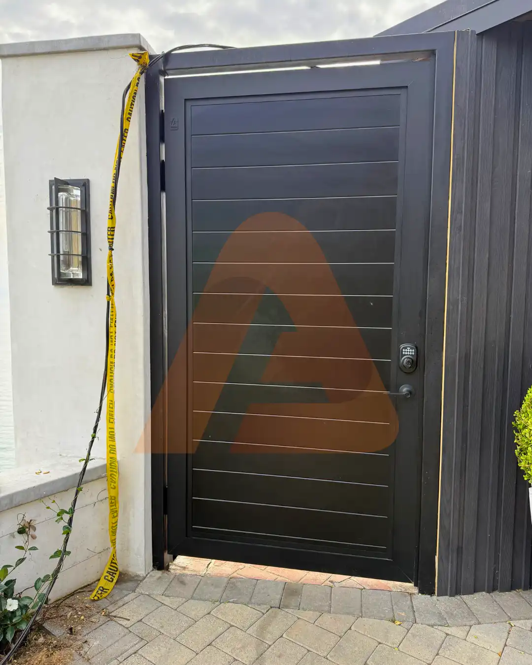 ALU 60 T&G black pedestrian gate installed by Aluglobus Aluminum Systems