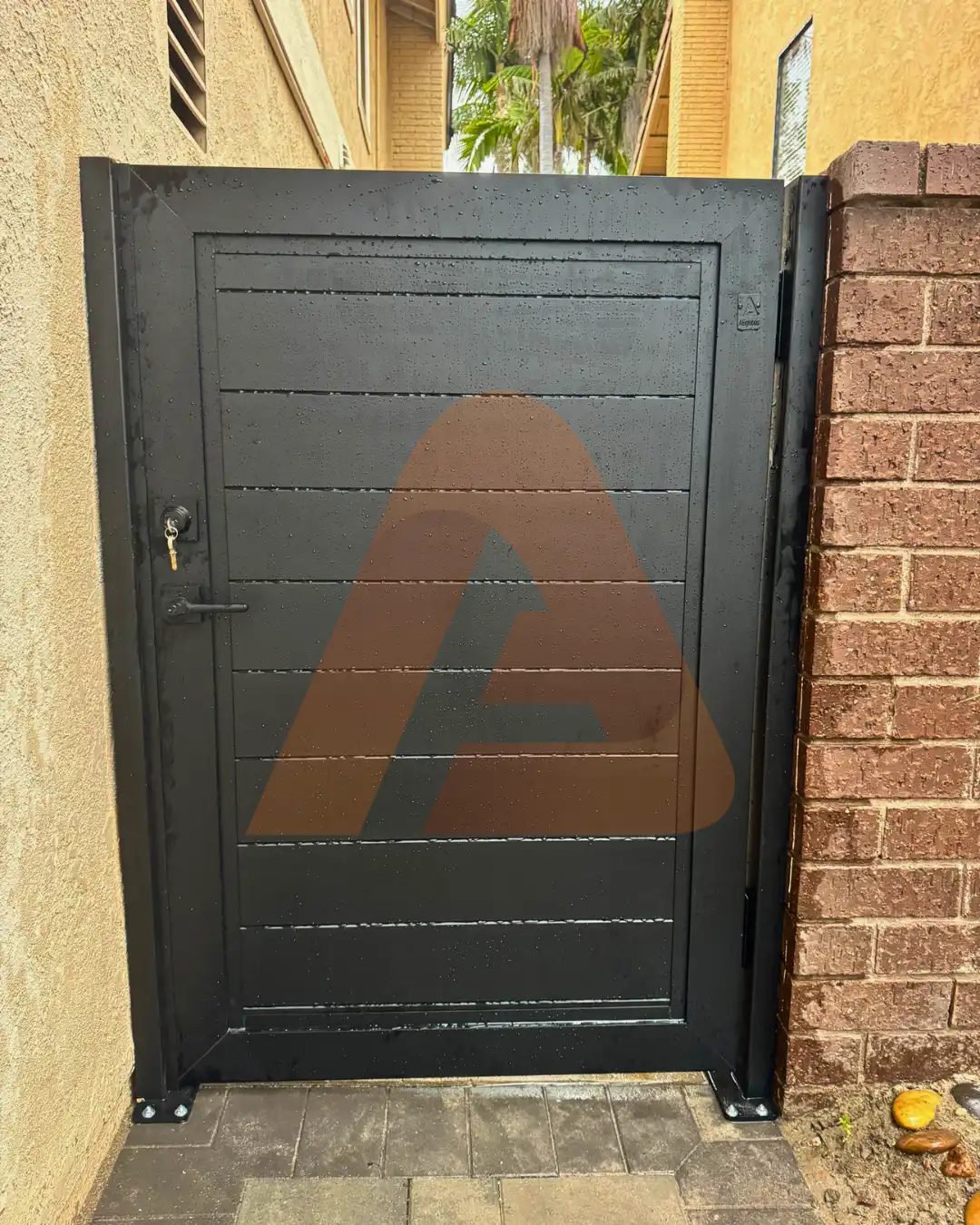 ALU 60 T&G black pedestrian gate installed by Aluglobus Aluminum Systems