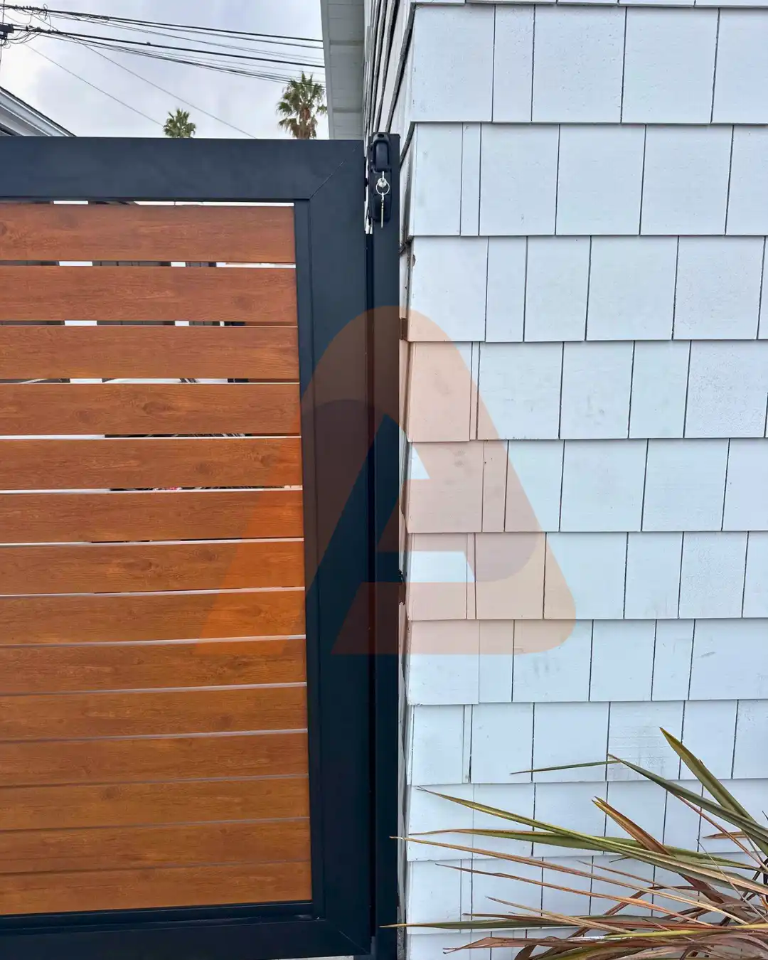 ALU 40 wood grain slat pedestrian gate installed by Aluglobus Aluminum Systems