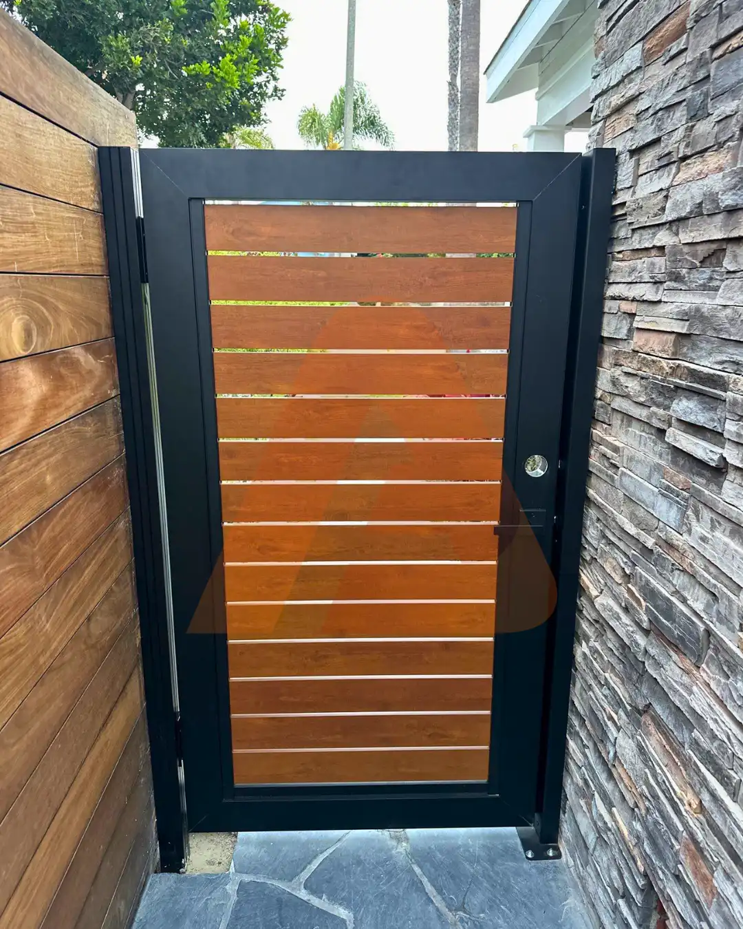 ALU 40 wood grain slat pedestrian gate installed by Aluglobus Aluminum Systems