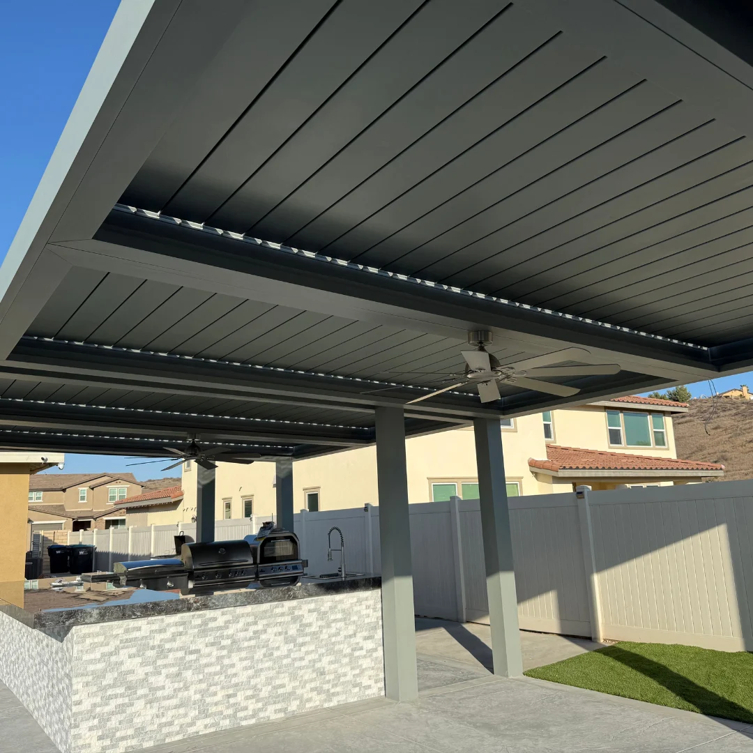 Closed gray louver roof with integrated LED lighting and ceiling fans