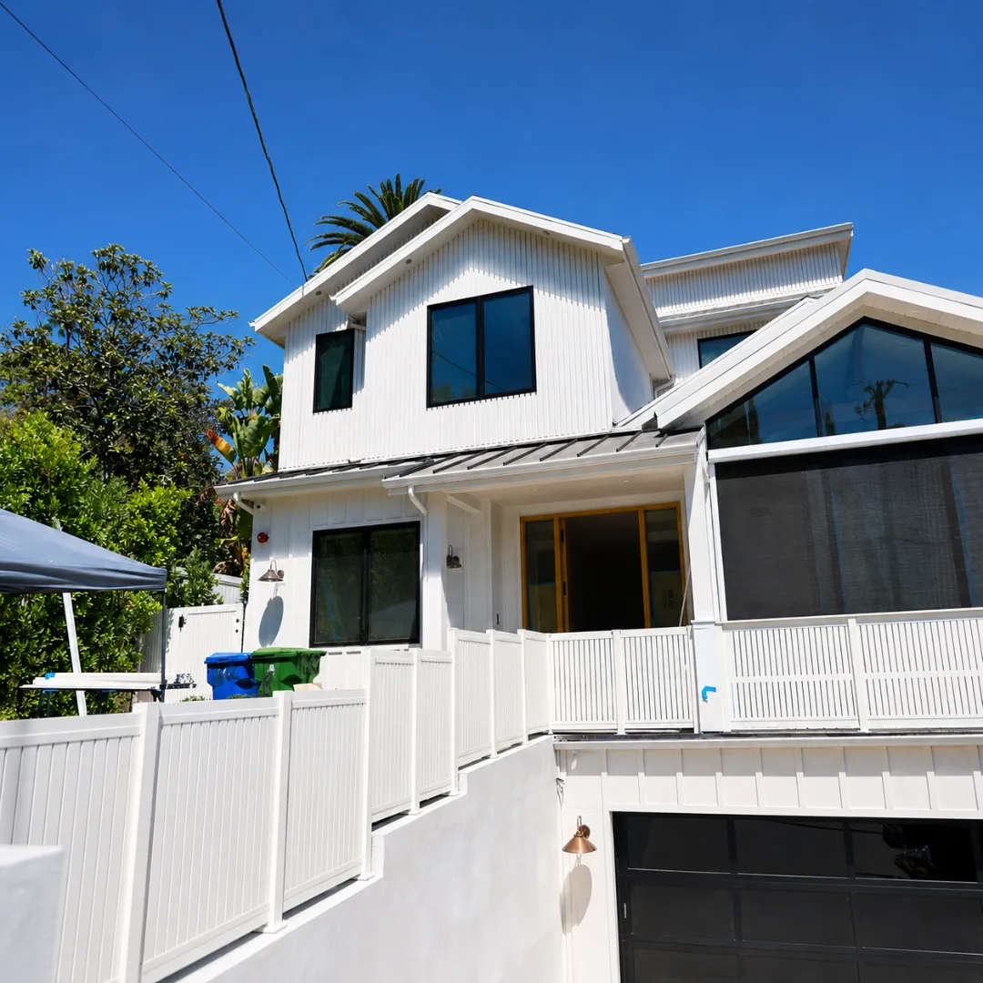 Modern white home exterior with coordinated aluminum outdoor systems