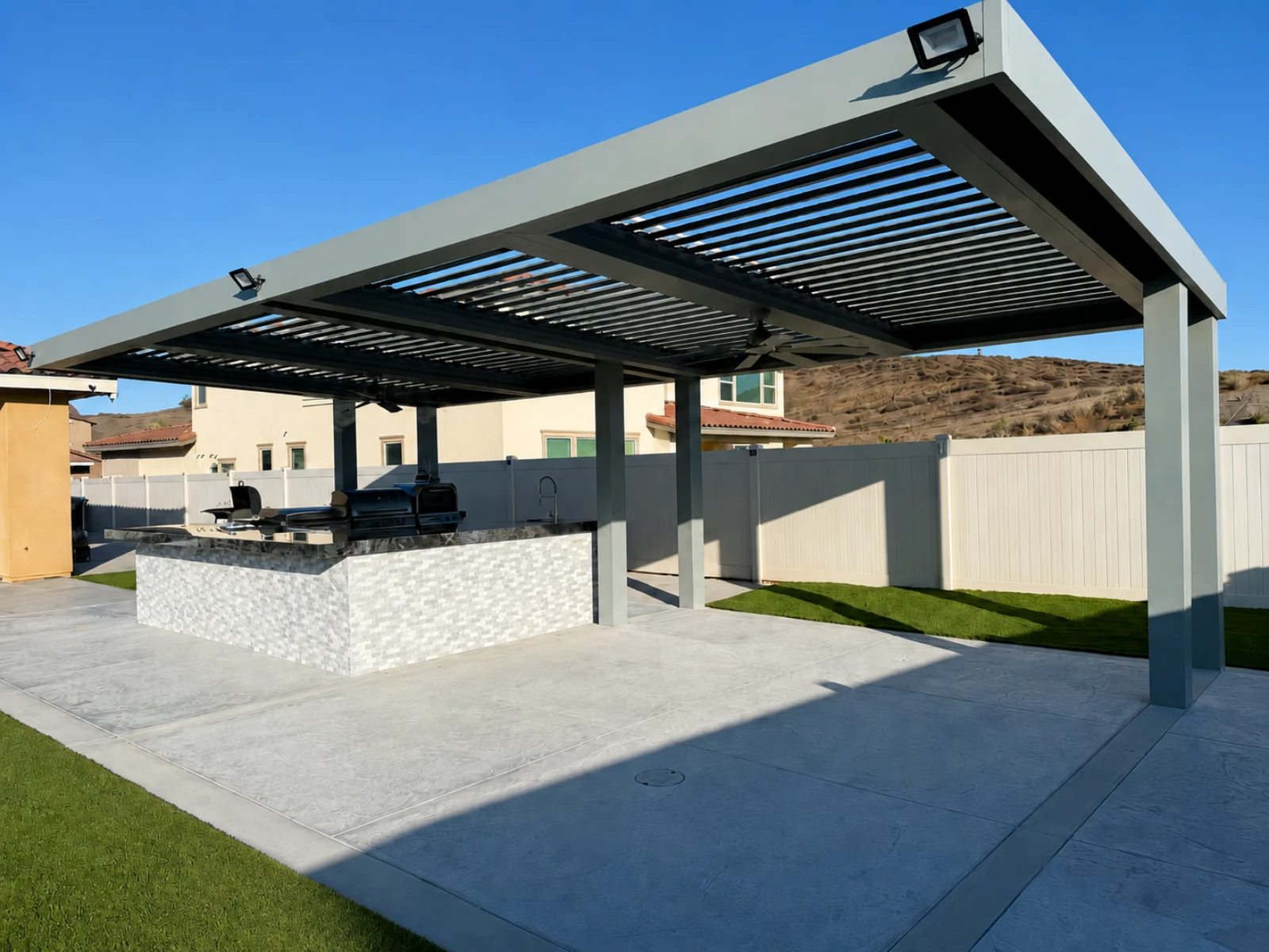 Completed automatic louver pergola patio cover in a residential outdoor setting
