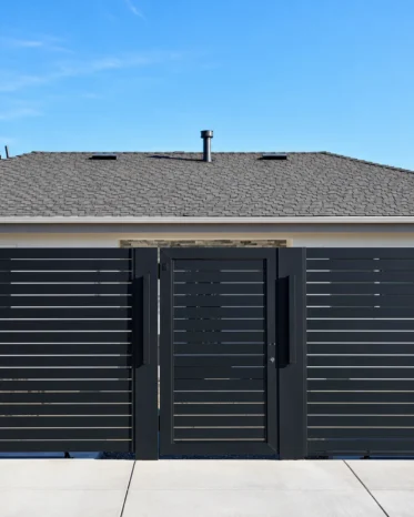 Matching Alu40 black horizontal aluminum pedestrian swing gate with modern security latch handle.