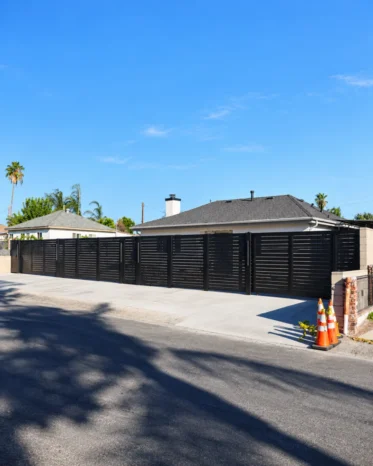 Marine-grade powder-coated black aluminum fence profile engineered for South Florida coastal weather.