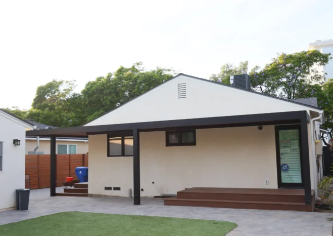 Custom insulated aluminium patio cover with black heavy duty posts installed in Westwood CA