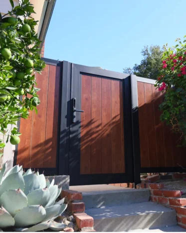 Aluglobus Aluminium System smart electronic lock installed on a woodgrain privacy fence gate in Hollywood.