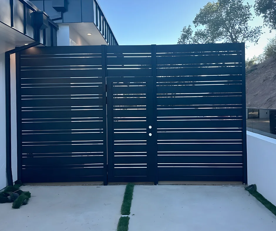 ALU20 black double gate closing a modern courtyard