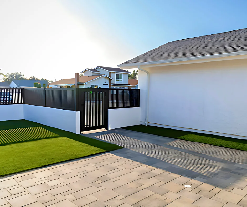 Black ALU20 fence and gate at a paver courtyard