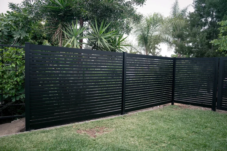 Black ALU20 fence around a wide backyard
