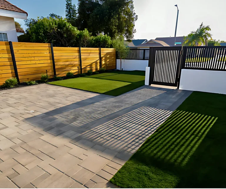 Wood grain and black ALU20 fences around a paver patio