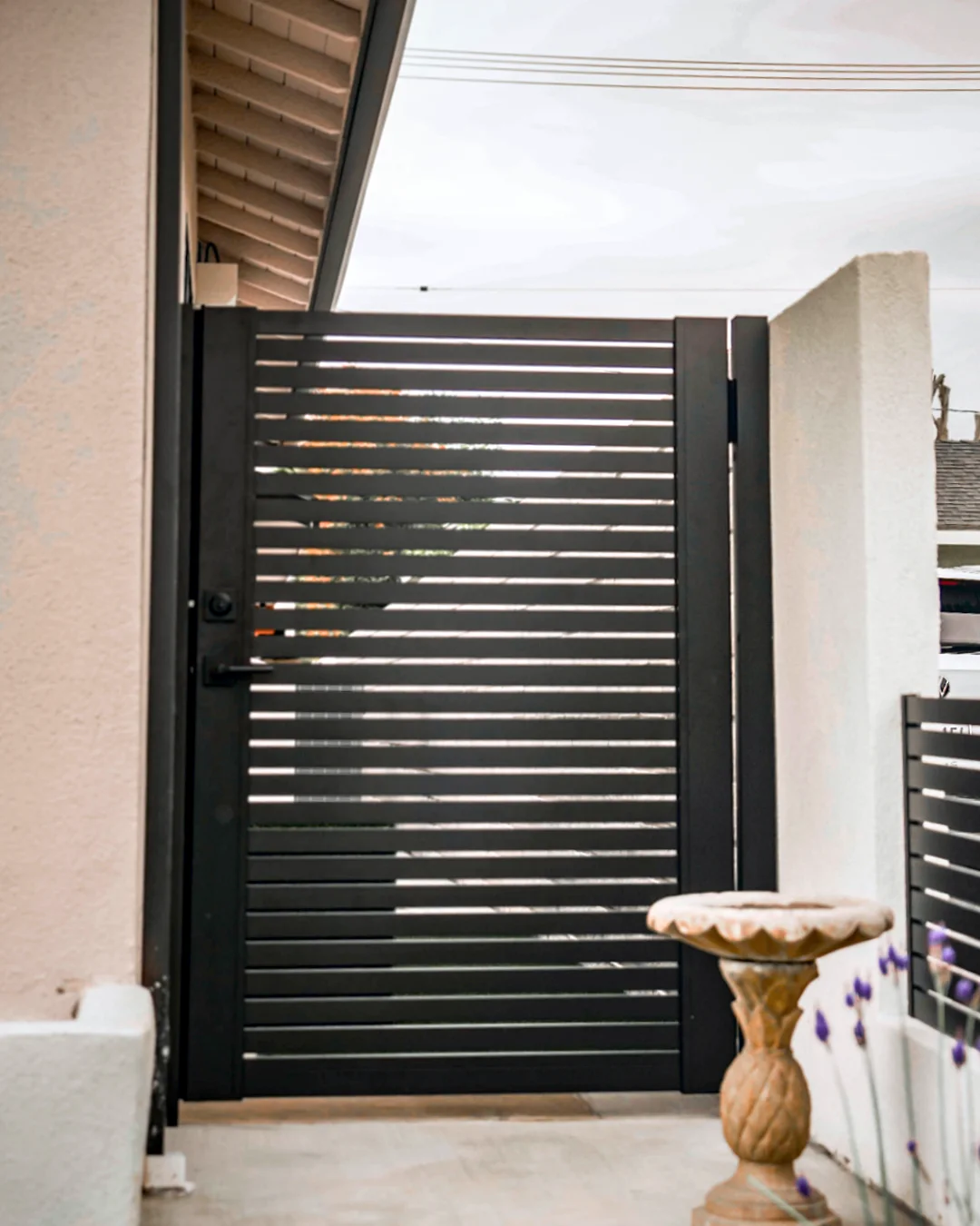 ALU20 black gate in a garden side yard