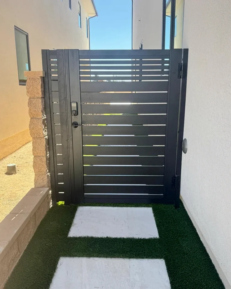 ALU20 black slat gate across a side yard walkway