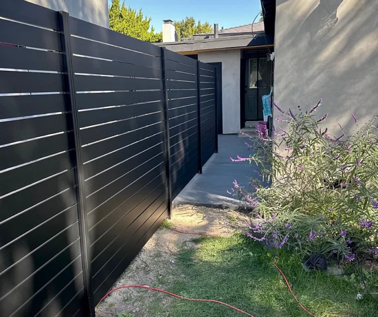 Black ALU40 fence along a side yard path
