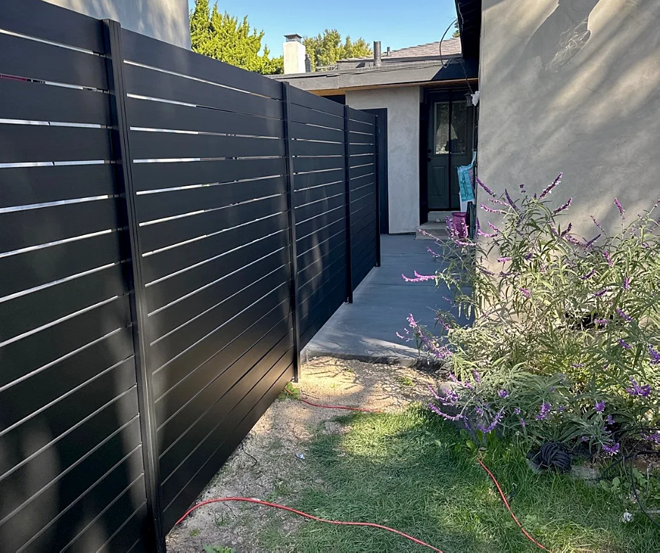 Black ALU40 fence along a side yard path