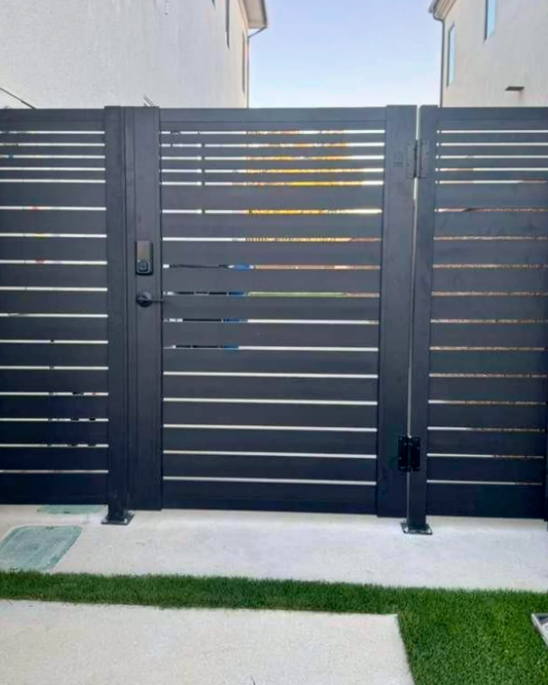 ALU40 black gate with fence panels over a lawn