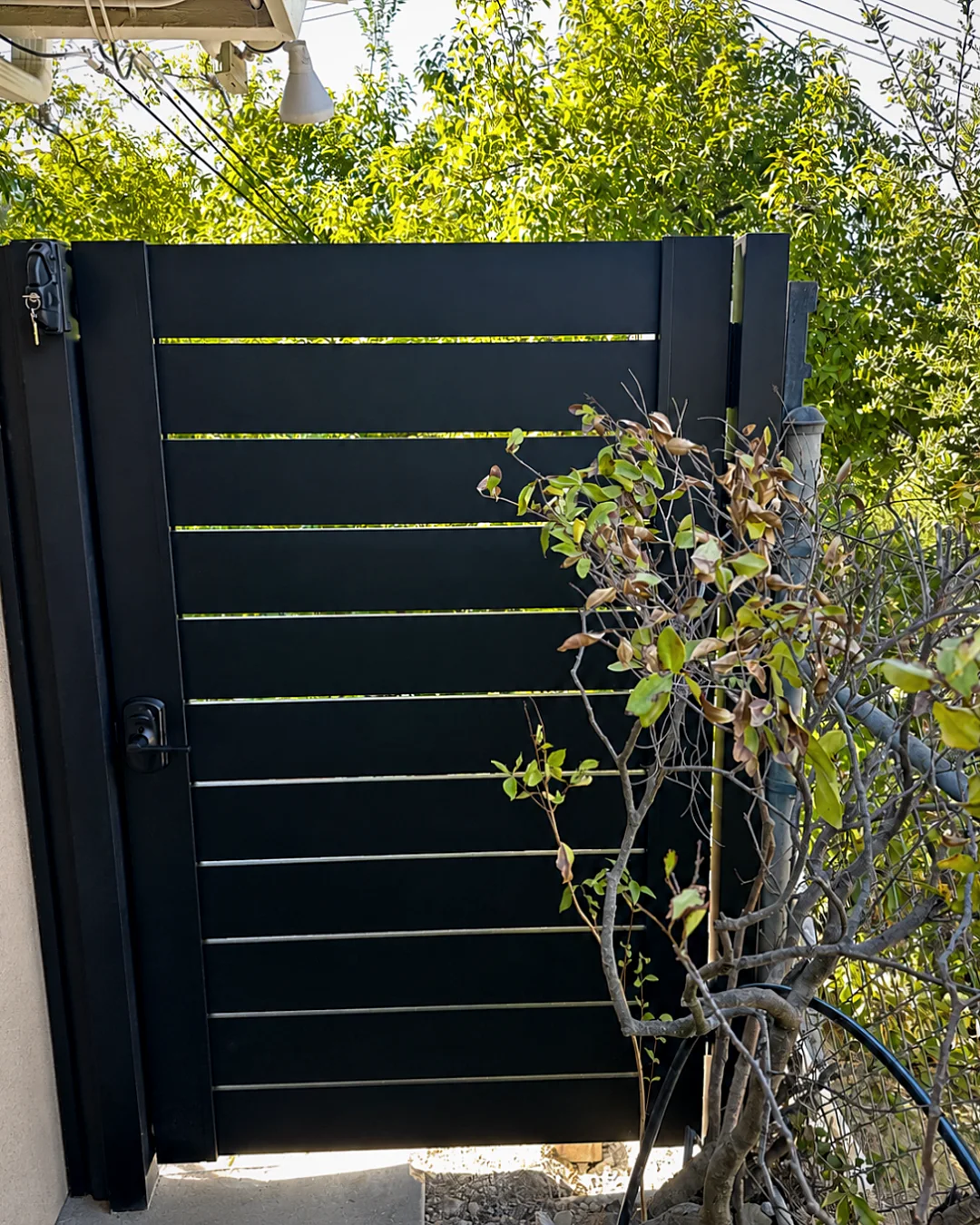 ALU40 black gate on a garden path