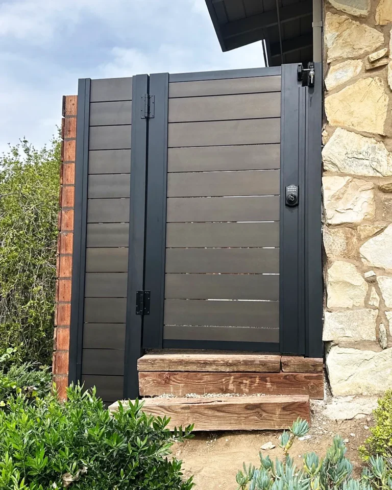 ALU40 gate beside a stone wall