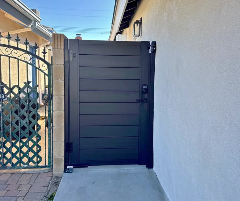 ALU60 full privacy black gate in a side yard