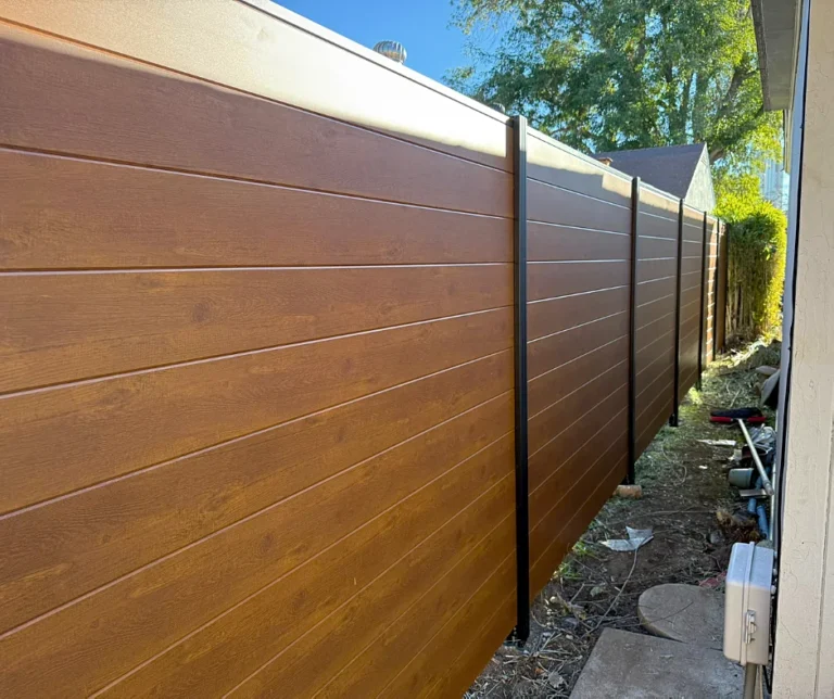 Wood grain ALU60 T&G fence along the side of a house