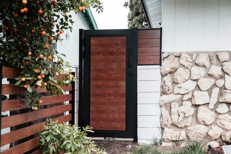 Woodgrain gate by stone