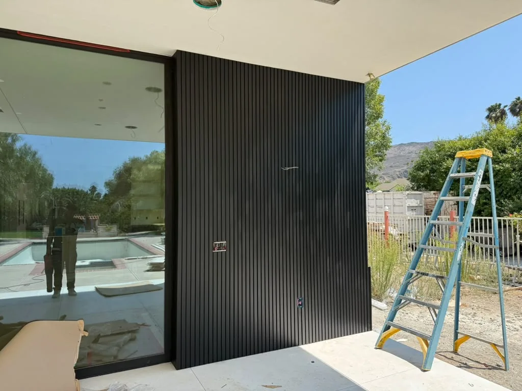 Black aluminum cladding on a pool house