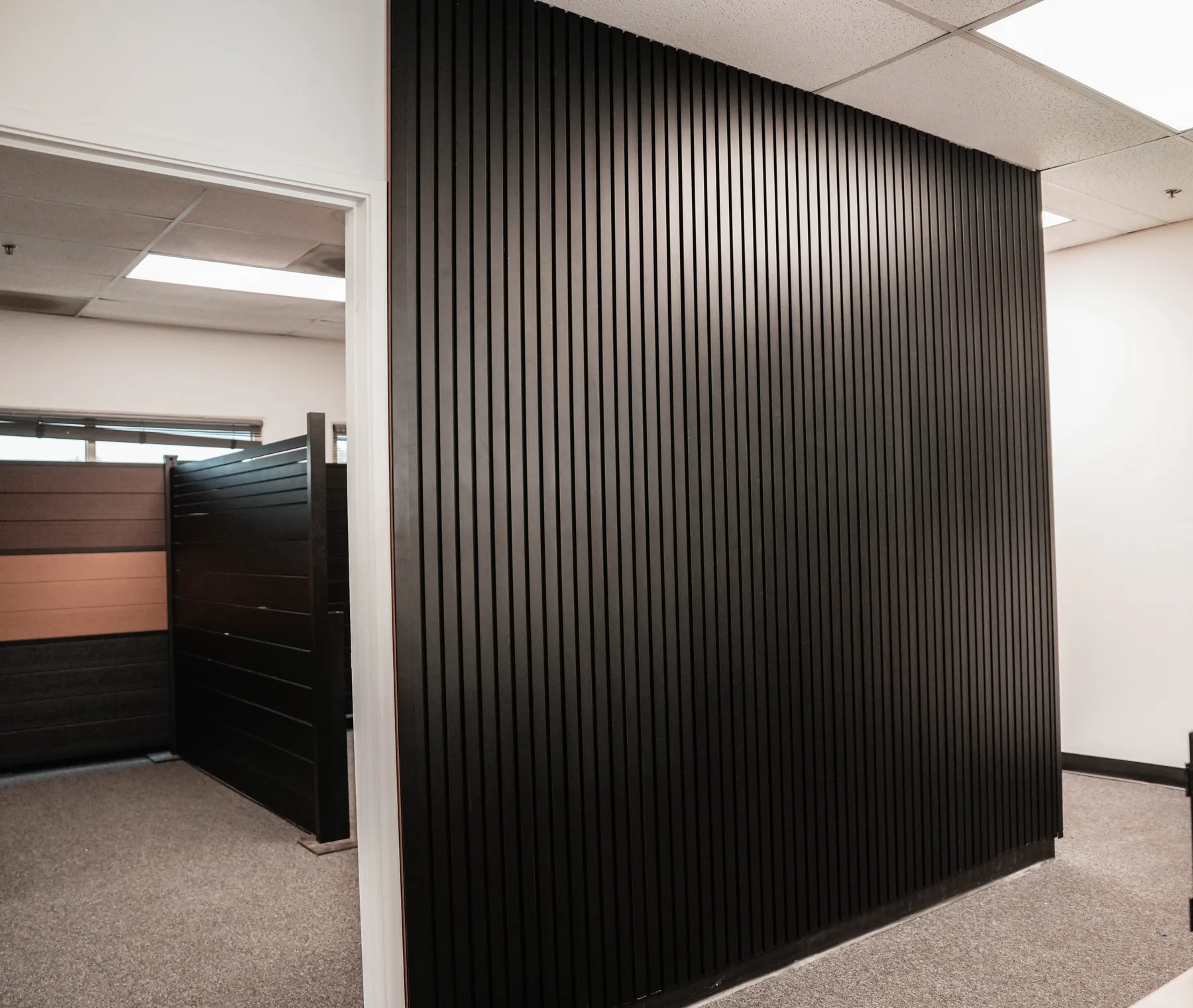 Black aluminum cladding wall in an office