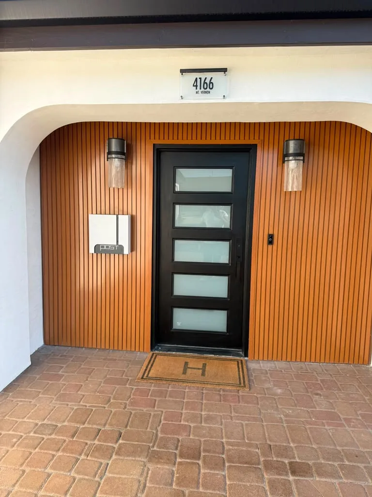 Woodgrain aluminum cladding around a front entry
