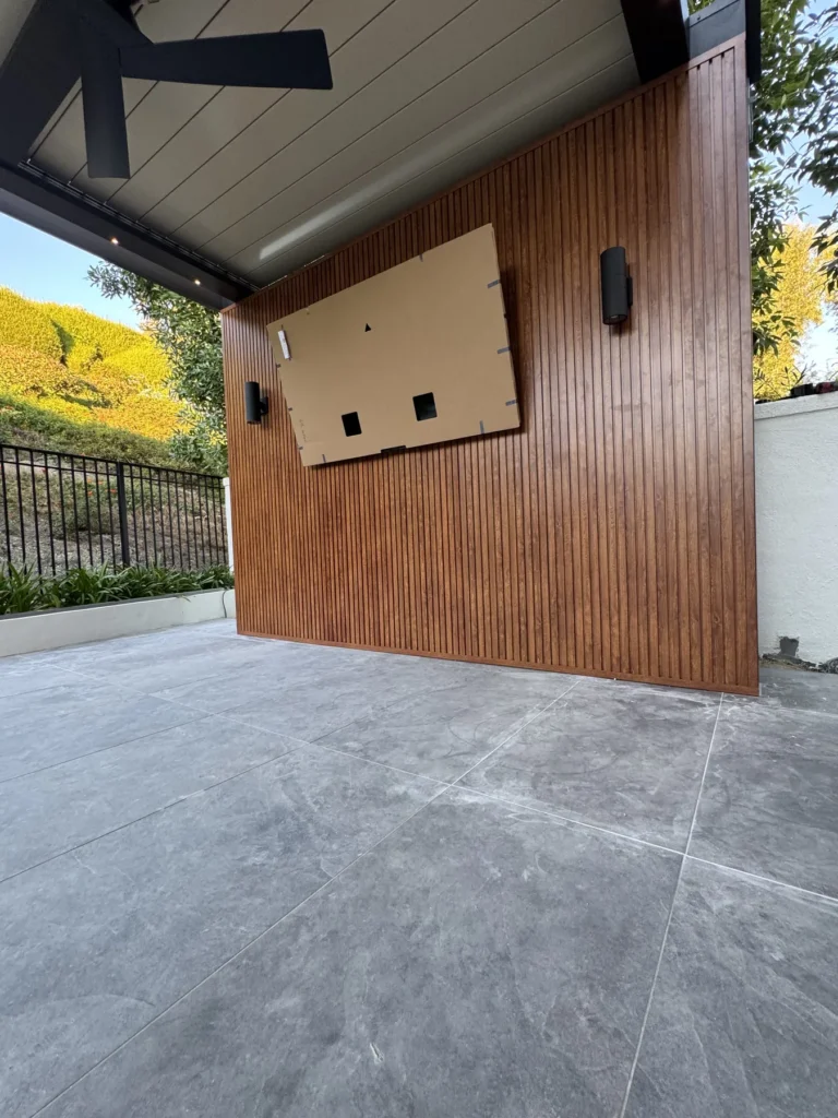 Woodgrain cladding wall by a patio