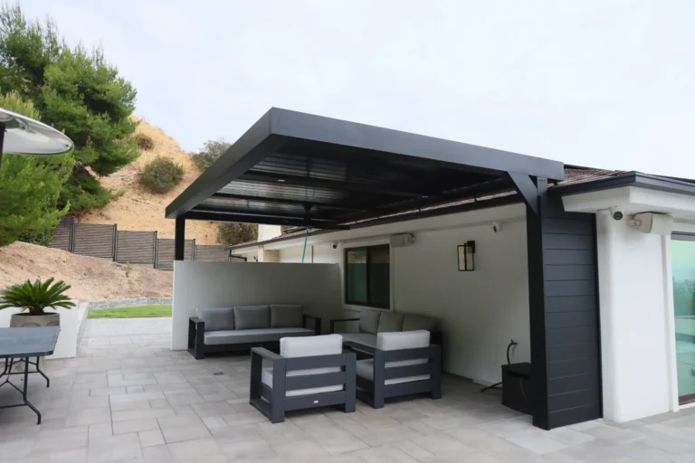 Black louvered patio cover with lounge seating, Burbank