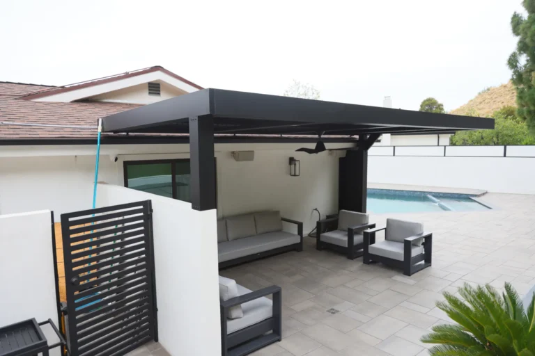 Louvered patio cover and privacy screen beside the pool