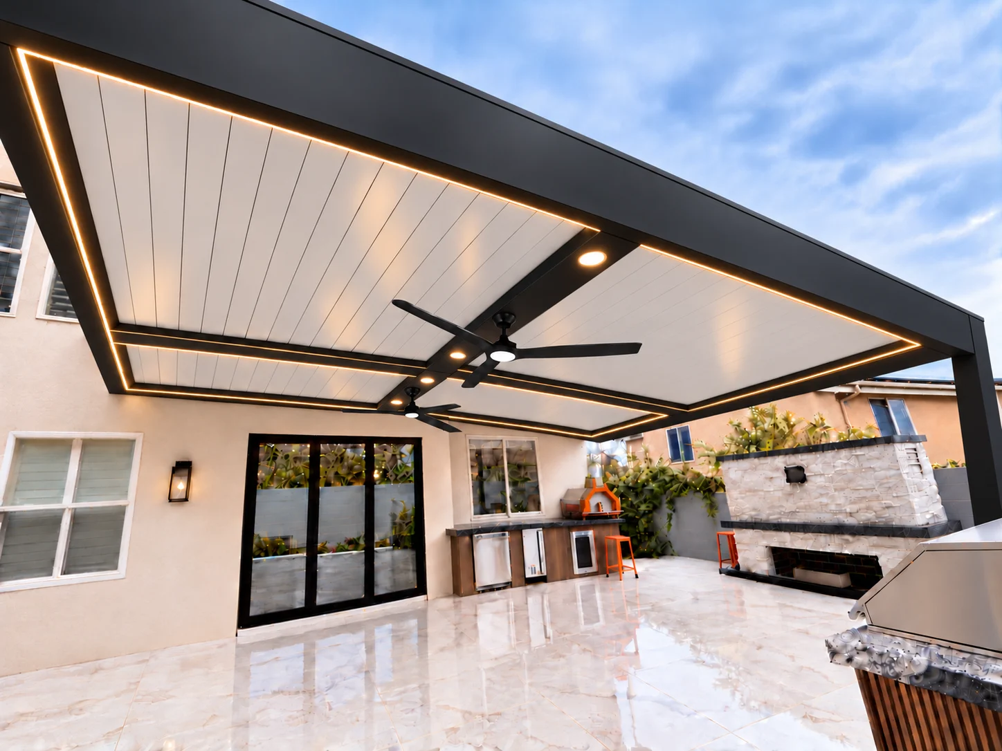 ALU FORTIS patio cover with a white roof, black frame and twin matte black ceiling fans