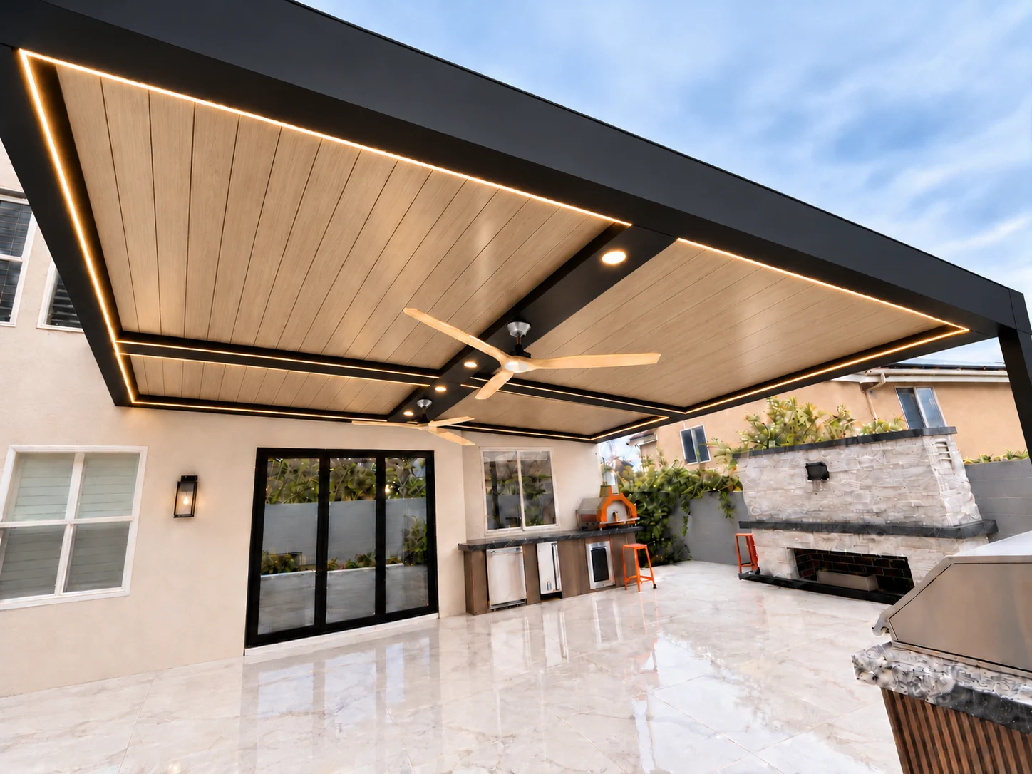 ALU FORTIS patio cover with a white oak woodgrain roof and black frame