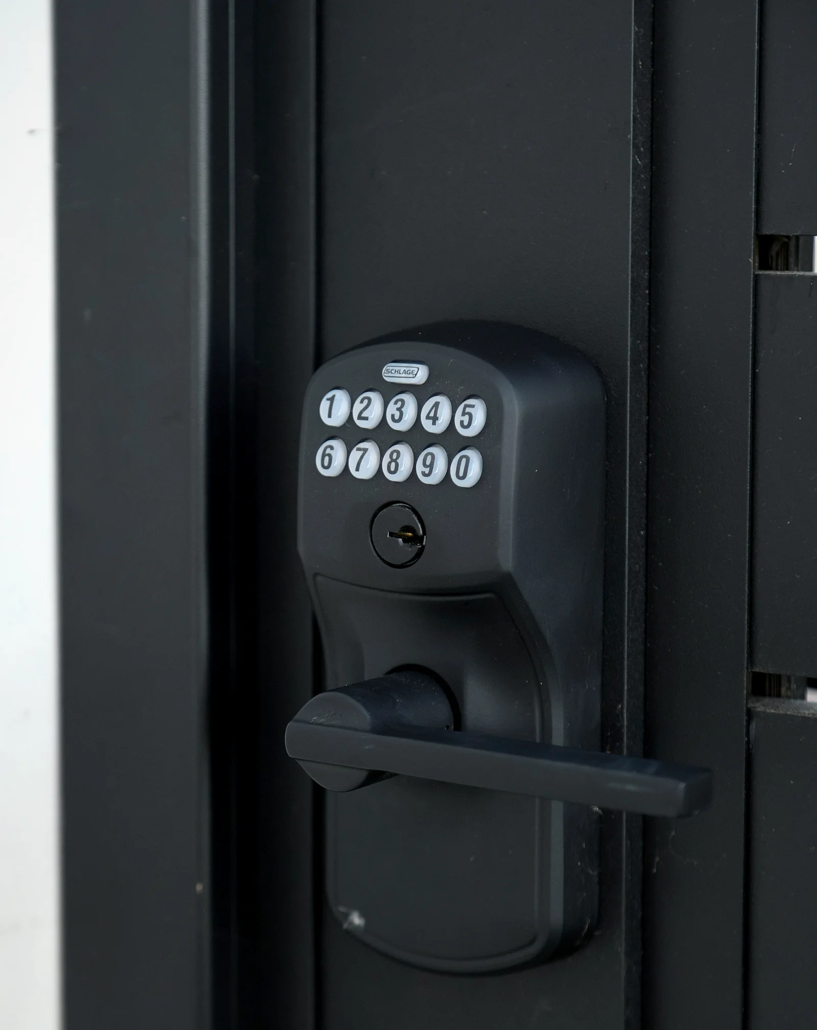 Keypad lever lock on an aluminum gate