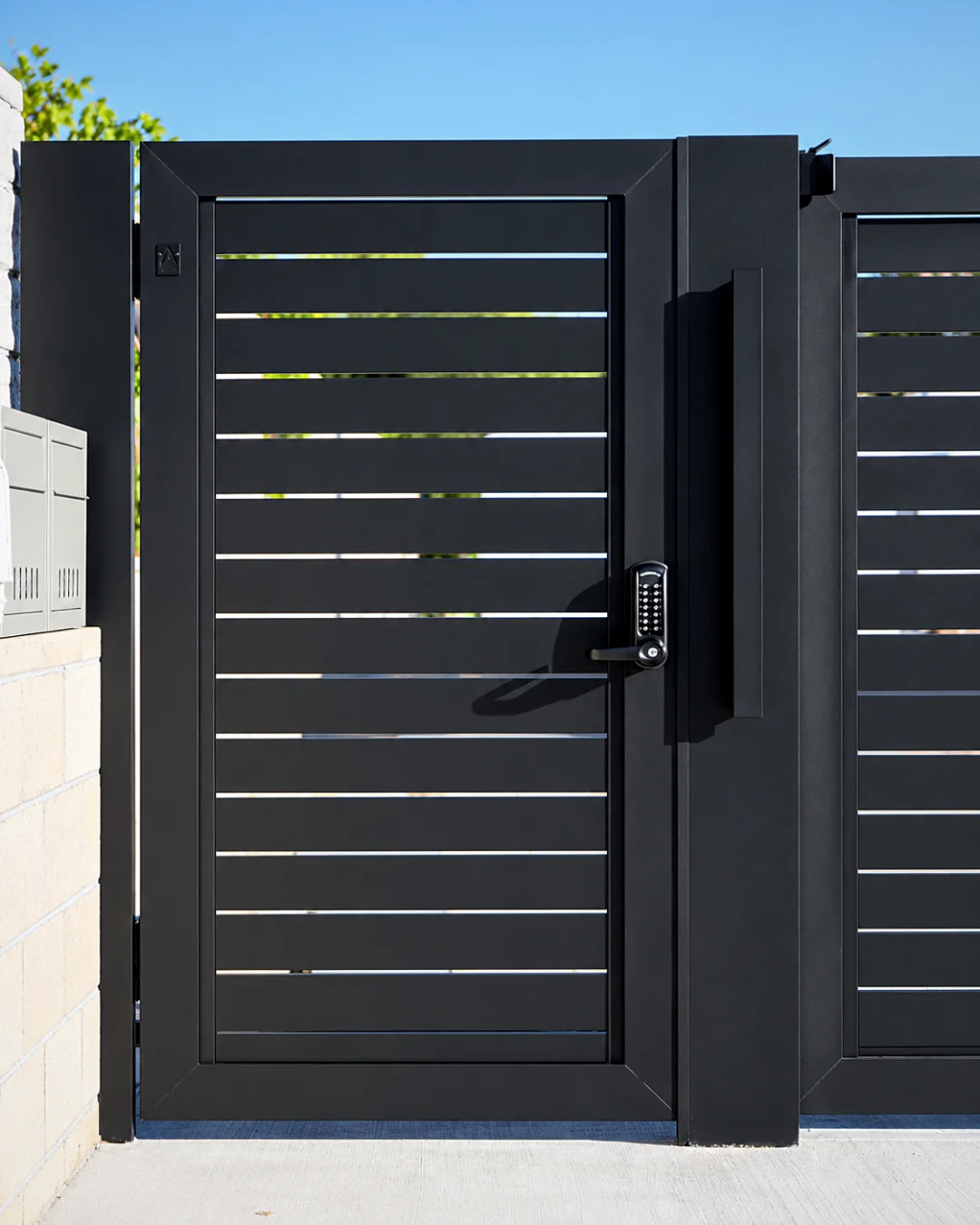 Keypad lock on a black gate