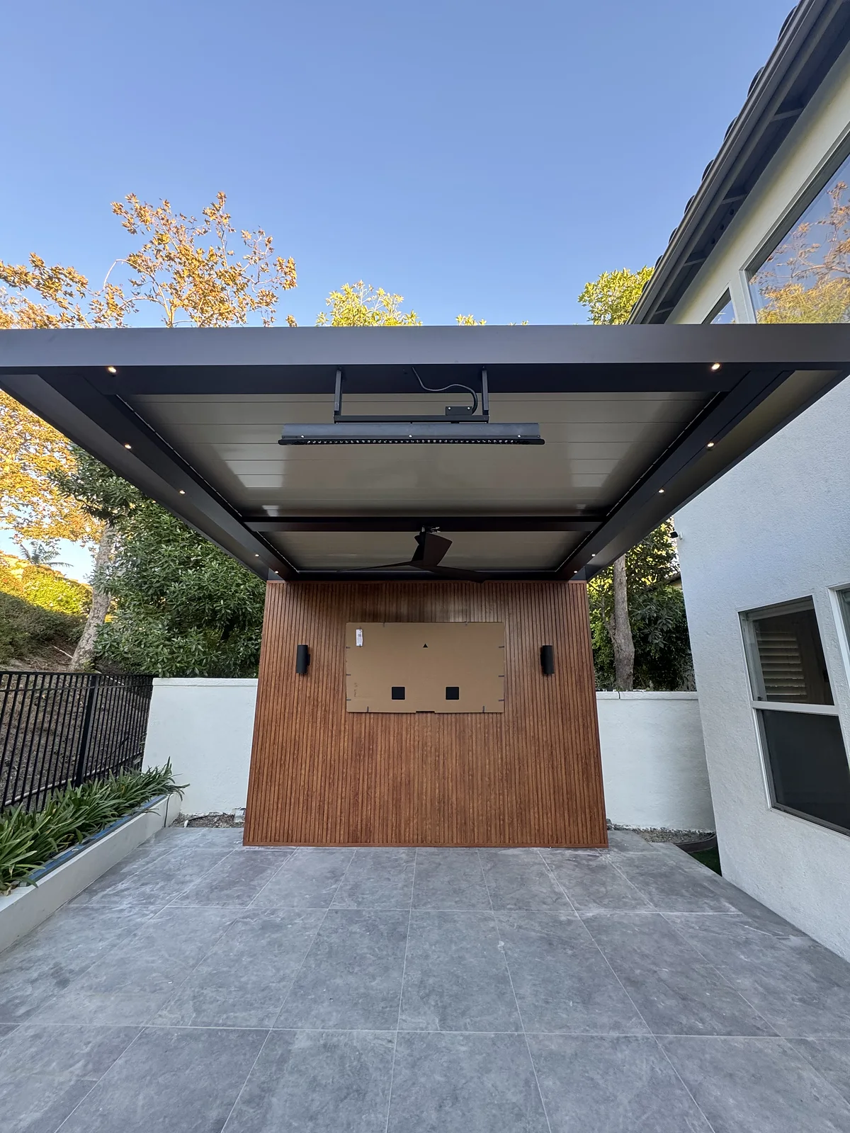 Woodgrain cladding wall on a covered patio
