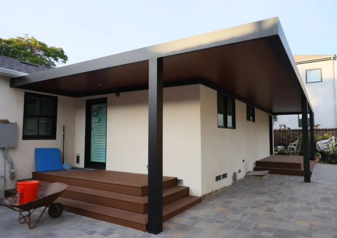 Custom insulated aluminium patio cover with black heavy duty posts installed in Westwood CA