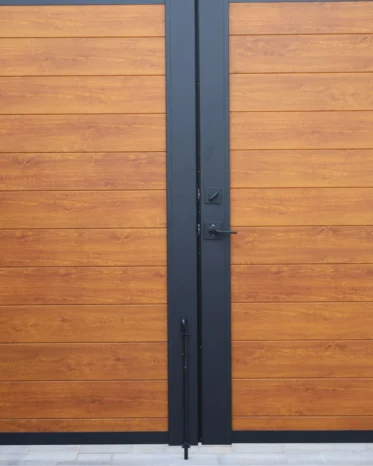 Zero gap double swing aluminum pedestrian gate offering 100 percent visual privacy for residential entryway.
