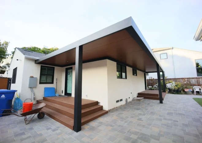 Custom insulated aluminium patio cover with black heavy duty posts installed in Westwood CA