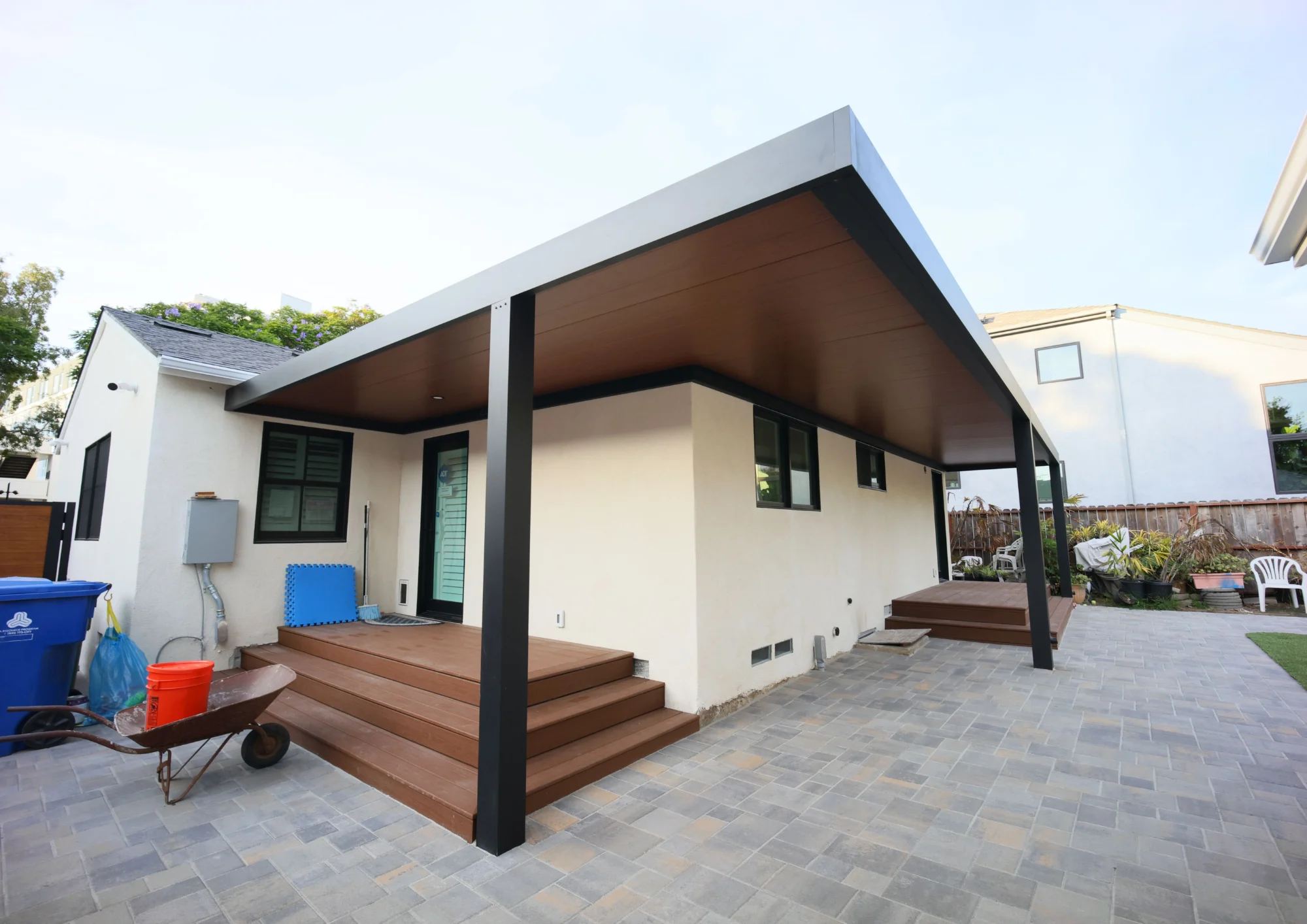 Custom insulated aluminium patio cover with black heavy duty posts installed in Westwood CA